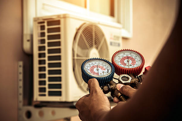 Professional Air Conditioning Service technician working in East Mc Keesport, PA